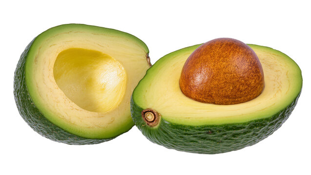 Ripe halved avocado with pit and green flesh
