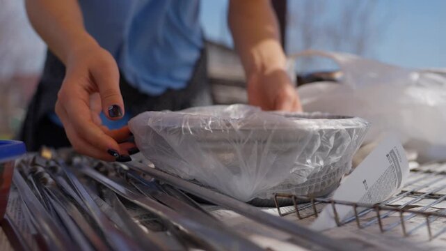 Bakery Dough Resting Under Wrap. Person Shielding Proofing Bread With Plastic Sheet Outdoors. Individual Covering Dough With Clear Film On Wire Rack During Outdoor Baking Preparation