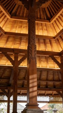 Interior Javanese Joglo House Architecture with Central Pillars Soko Guru and Tiered Wooden Ceiling