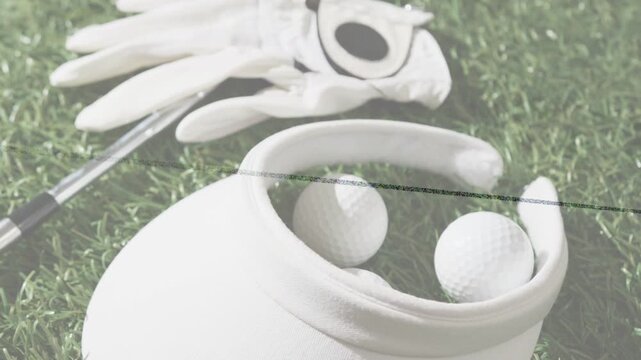 Camera pulling focus across golf pouch holding two balls, revealing glove, club, scan-line artifact