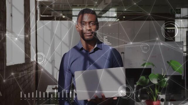 Male tech pro holding laptop in loft, animated HUD appearing and guiding laptop lowering for demo