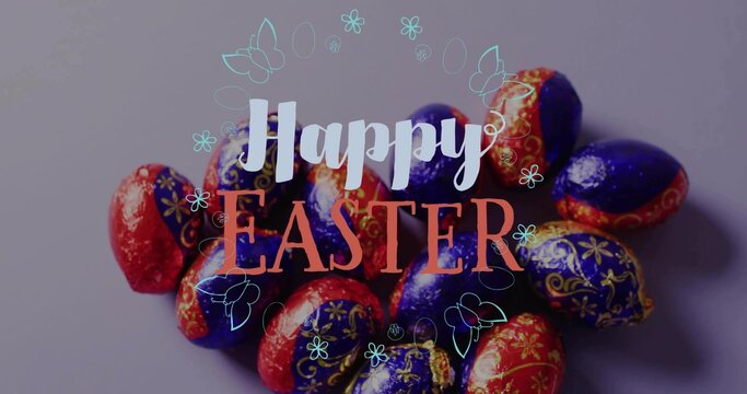 Displaying foil-wrapped Easter eggs glinting on mauve-gray tabletop, Happy EASTER and teal doodles