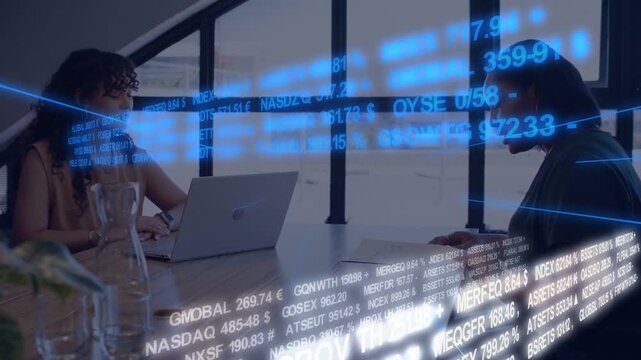 Left woman typing laptop, right reading market report, starting stock ticker streaming across table