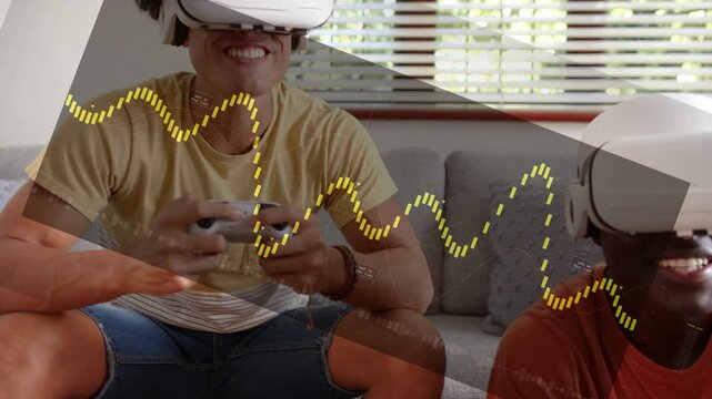 Two men on sofa playing VR, controller pressing starting yellow waves over frame, laughing for fun