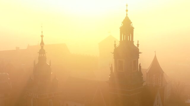Aerial view of Wawel Castle during foggy sunrise, Krakow, Poland