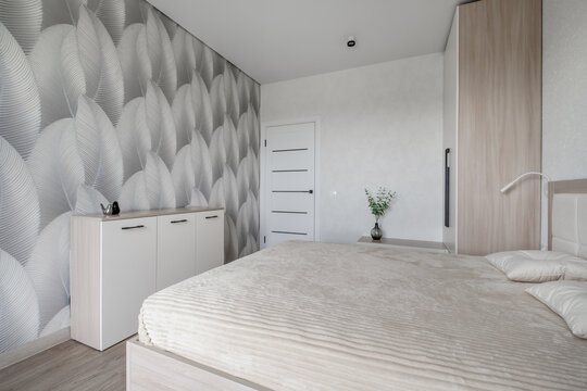 Interior of modern luxure bedroom in studio apartments or hotel with double master bed