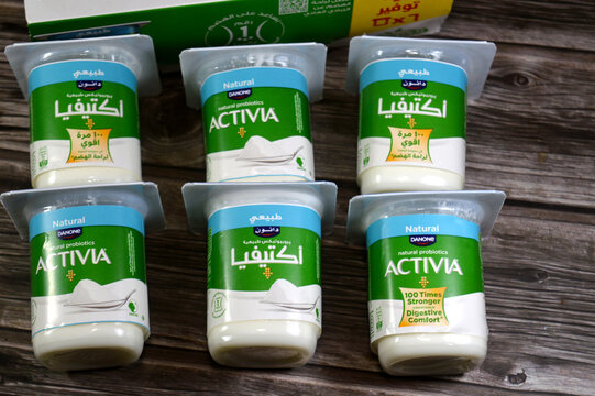 Cairo, Egypt, April 25 2026: pile of Activia Natural Probiotic Yogurt, a creamy, fermented dairy product manufactured by Danone, contains billions of live, active cultures the probiotic strain
