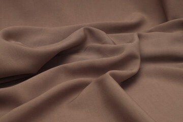 Obraz premium Mocha beige, brown drapery Wave podium platform Silk Fabric. Abstract light and shadow texture art background.