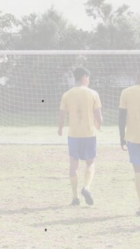 Vertical video: Centered soccer player in wall clapping after keeper diving to save shot by shooter