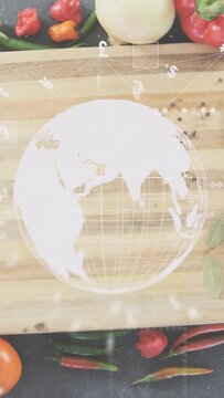 Vertical video: tap initiating holo globe rotating over board, visualizing currency flow over veg