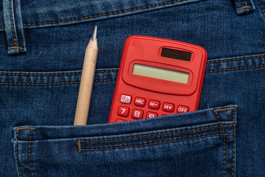 Red Calculator and Pencil in Denim Pocket - Back to School Concept with Casual Style