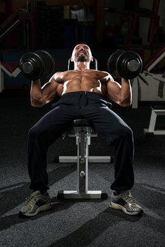 Mature Man Doing Dumbbell Incline Bench Press Workout