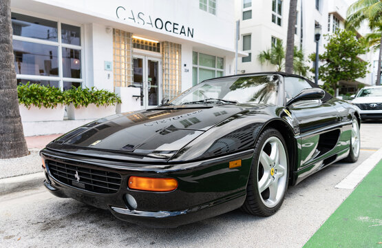 Miami, Florida, USA - July 27, 2025: Ferrari F355 Spider 1996 convertible car. Convertible car Ferrari F355 Spider. Car Ferrari F355 Spider parked outdoor. Black convertible, corner view