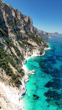 Aerial view of Cala Goloritz&egrave;, Baunei Coast, Sardinia, Italy. Iconic turquoise waters, white limestone cliffs adn pristine beach, often ranked among the most beautiful beaches in the world