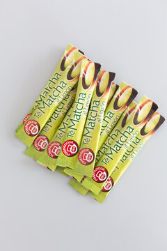 Alicante, Spain - April 25, 2026: Matcha green tea powder packets arranged in a neat row on a light gray background for beverage preparation and health-focused consumption