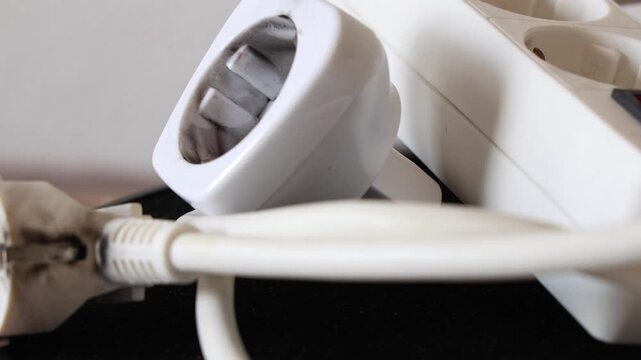 Damaged power plug and voltage adapter, electric short circuit