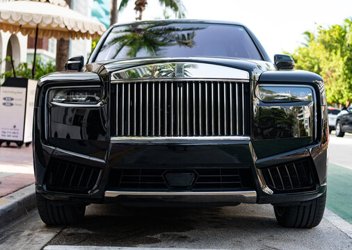 Miami, Florida, USA - July 27, 2025: Car Rolls Royce Cullinan parked outdoor. Black SUV car, corner view. Rolls Royce Cullinan 2025 SUV car. Luxury SUV car Rolls Royce Cullinan