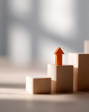 orange upward arrow rising over staircase made of wooden building blocks, minimal background, business improvement concept, soft natural light, copy space