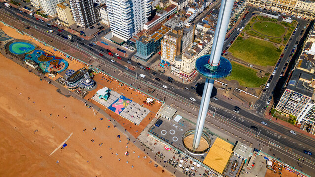 High drone perspective of i360 tower pod above beachfront promenade
