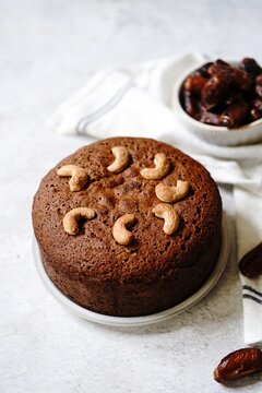 Homemade Dates carrot cake with nuts, selective focus