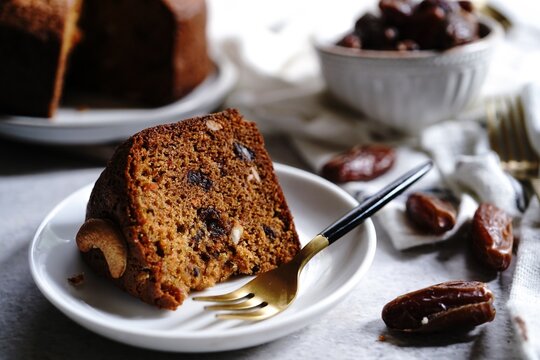 Homemade Dates carrot cake with nuts, selective focus
