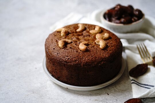 Homemade Dates carrot cake with nuts, selective focus