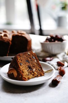 Homemade Dates carrot cake with nuts, selective focus