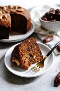 Homemade Dates carrot cake with nuts, selective focus