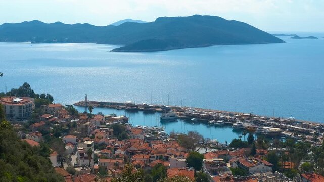 Scenic view of kas harbor and mediterranean sea. Beautiful panoramic view of the coastal town of kas in turkey, showing the charming harbor filled with boats and the sparkling turquoise sea
