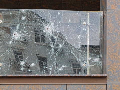 Damaged armored glass fence