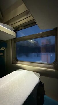 Peaceful train compartment interior with empty bed and soft evening light through window, cinematic travel mood, cozy and serene atmosphere, perfect for lifestyle, travel, and storytelling projects