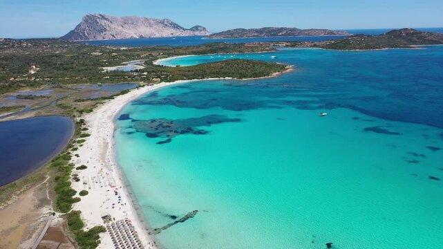 Spiaggia di Lu Impostu 4K Aerial View of Cala Brandinchi SARDINIA  , Lu Impostu Bays. Cinematic aerial Drone Flight over Little Tahiti Turquoise Sea and White Sand. San Teodoro  top of Sardegena beach