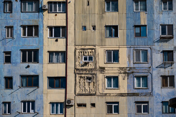Fototapeta premium Geometric Soviet Era Apartment Facade with Blue and Yellow