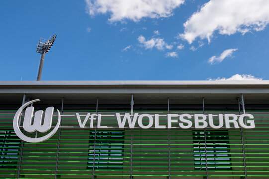 WOLFSBURG, GERMANY, 26 April 2026: VfL Wolfsburg football club logo on stadium Wolfsburg Arena building against blue sky