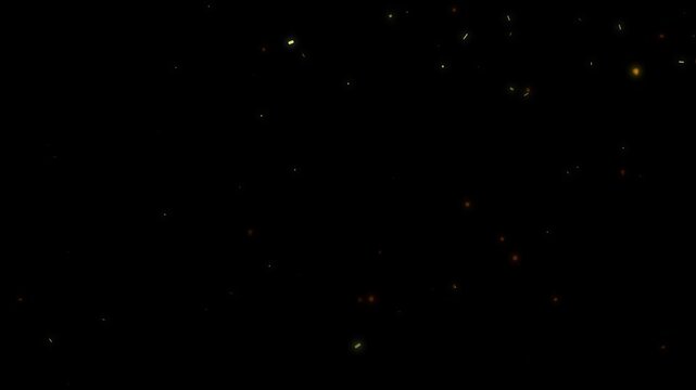 Abstract golden light particles gently floating and disappearing on dark background movement