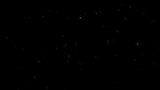 Fiery glowing embers slowly float and rise in dark space providing dynamic particle motion