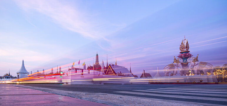 BANGKOK, THAILAND - DECEMBER 4, 2013: A street-level view captures the morning atmosphere at a busy intersection near the Grand Palace (Wat Phra Kaew) and Sanam Luang.