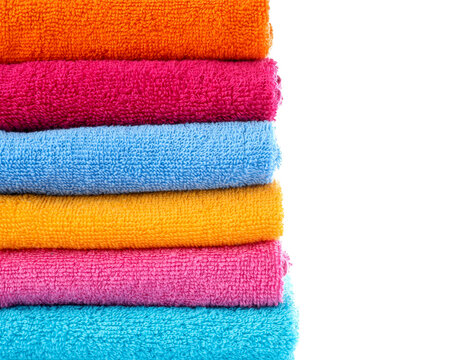 Stack of folded colorful terry towel isolated on white