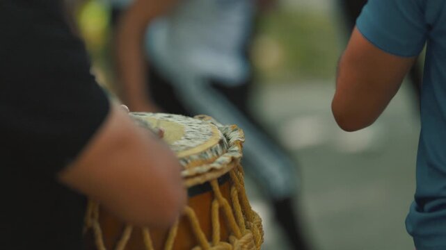 Close-up of musician playing djembe drum
