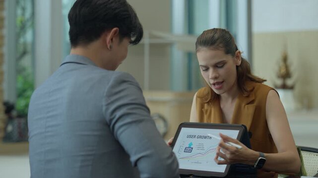 Business model marketing strategy ai meeting modern office, tablet teamwork guide to user growth as teammates present data screen, collaborative planning and analytics drive clear, confident decisions