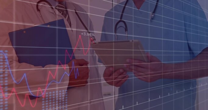 Reviewing charts, two MDs in labcoat and scrubs in clinic holding tablet, stethoscopes with overlay