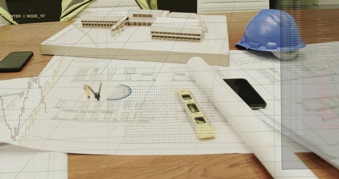 Displaying architectural work area covering design office table, with scale model, blueprints level