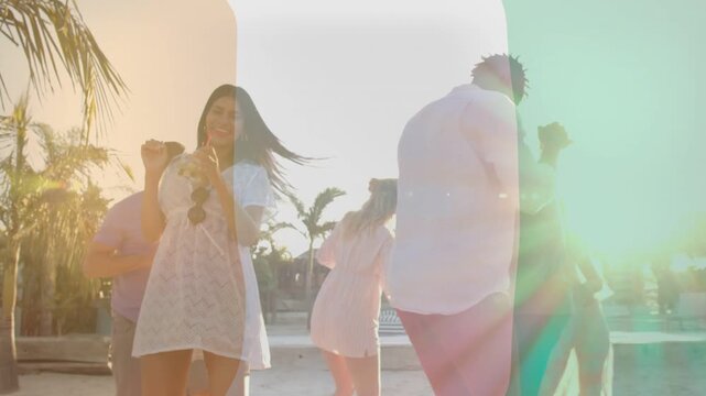 Five adults dancing on beach camera panning revealing lens flare overlay celebrating for marketing