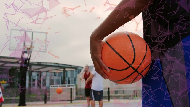 Front player holding basketball while peer shooting sparking midair for pickup, pink court overlay