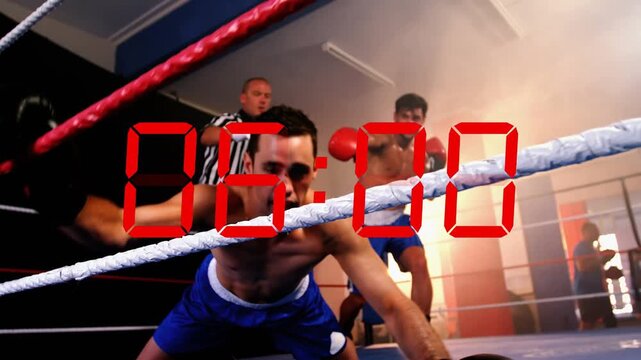 Boxer landing strike to win flooring opponent while ref counting and red countdown overlay running