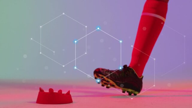 Foot entering triggers sports kicker placing ball on red tee for kick, animated hexes marking nodes