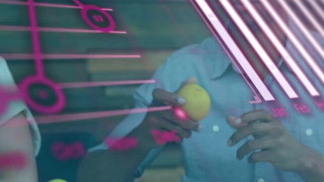 Left reaching for apple, right man receiving and inspecting it during food pink data charts overlay