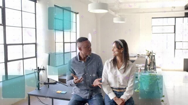 Man pitching and gesturing, woman listening in business, bars animating across phone to show data