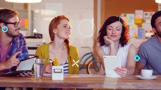 Team noting tapping tablet at table, man entering sparking animated charts over tablet for business