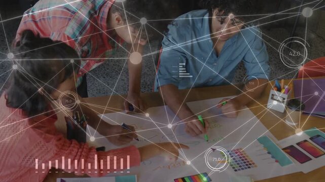 Designers leaning in sketching on desk while animated nodes linking color swatches to align layout